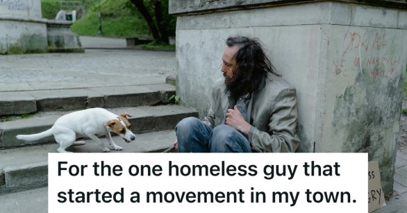 Homeless man sitting on the steps with a dog