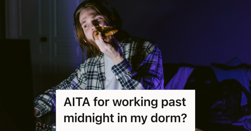 man eating pizza working on computer