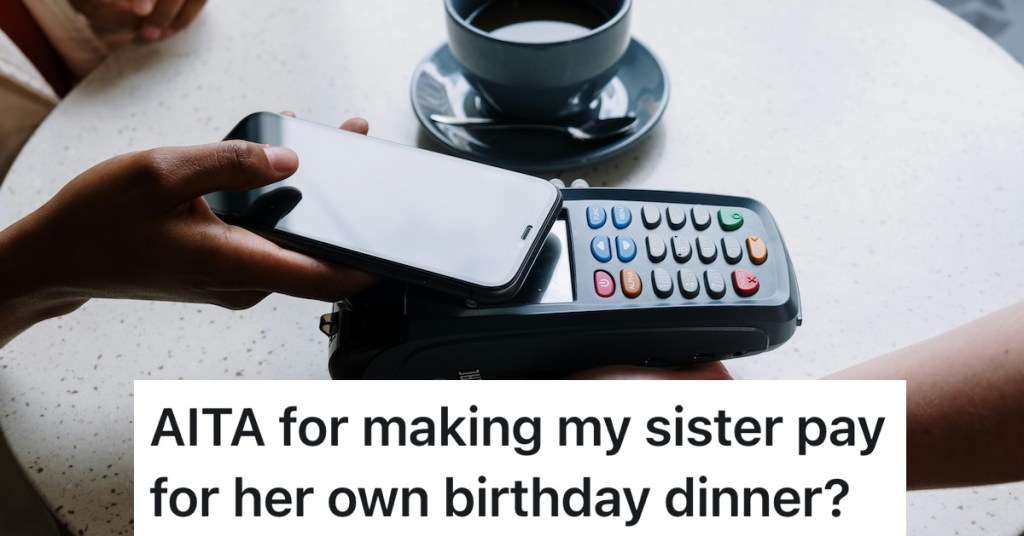 person paying for a bill with their phone