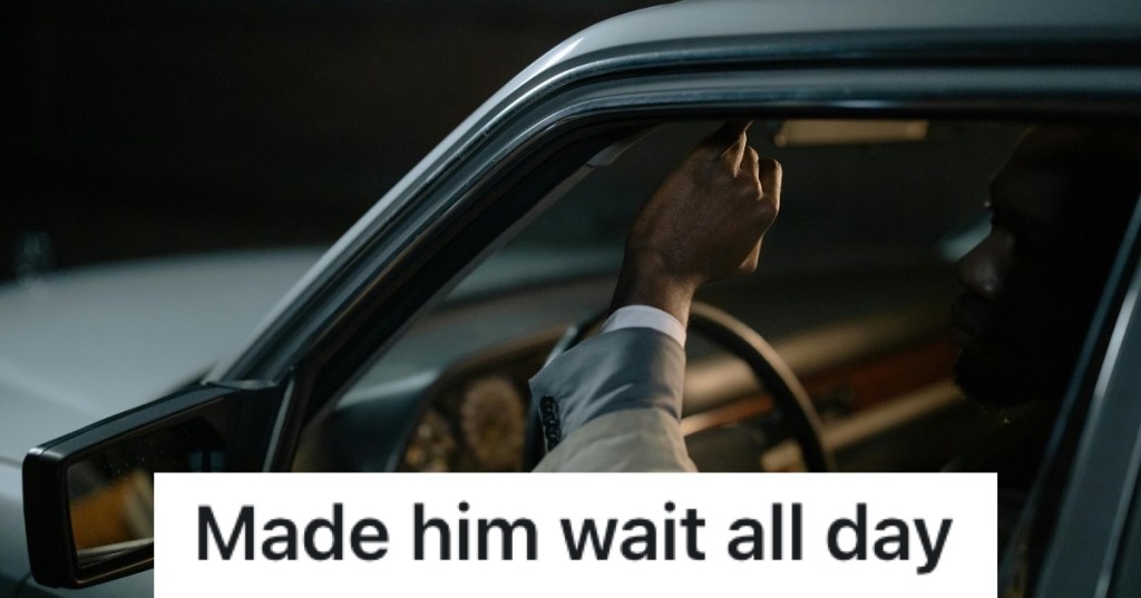 man sitting in his car