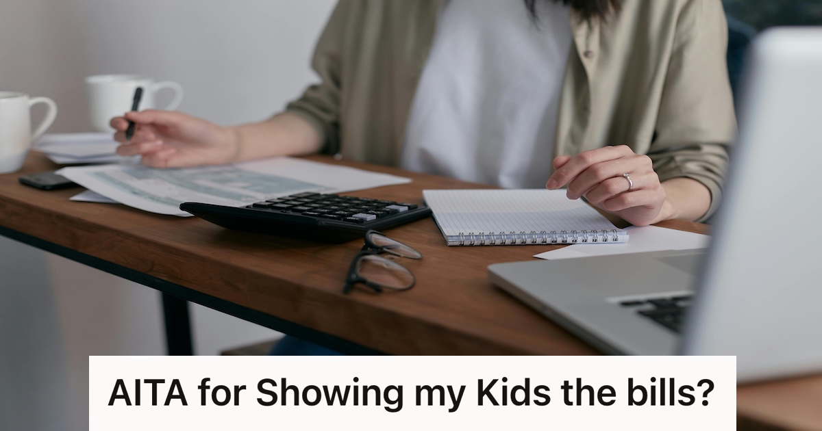 woman doing bills at the table