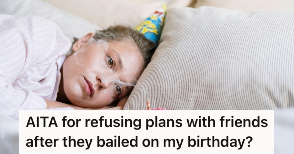 A sad woman lying down with a party hat on