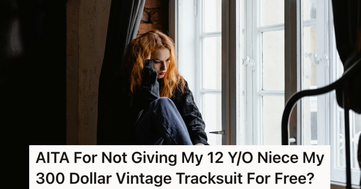 A woman sat behind a curtain