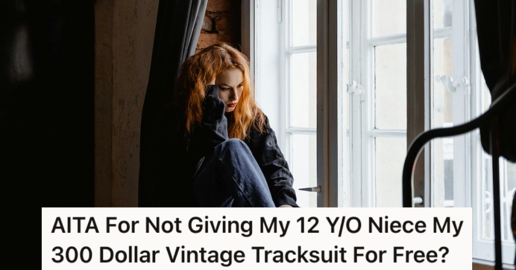 A woman sat behind a curtain