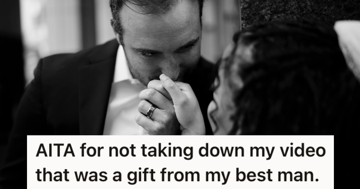 A groom kissing his bride's hand