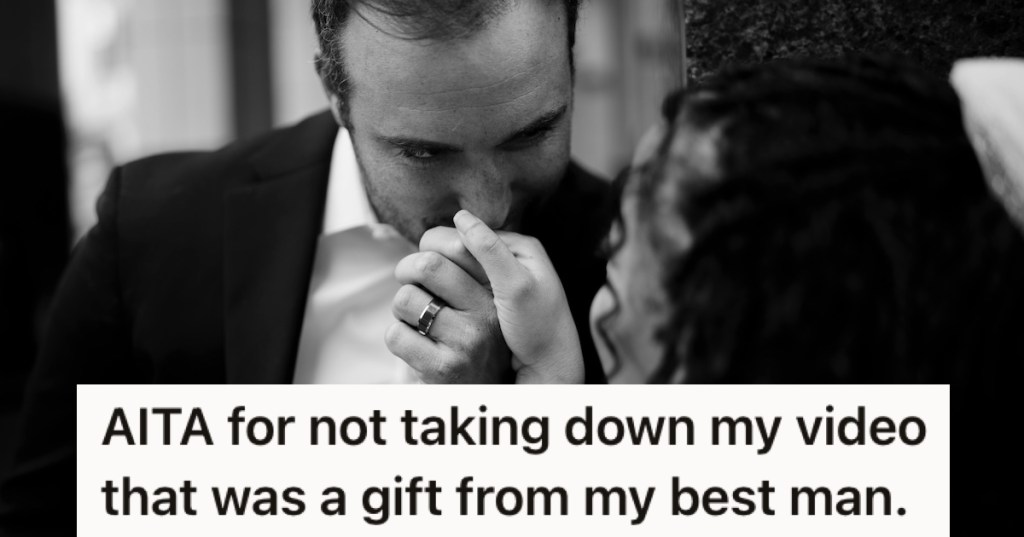 A groom kissing his bride's hand