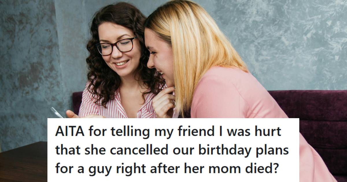 Women sitting at a table, looking at photos and catching up on gossip