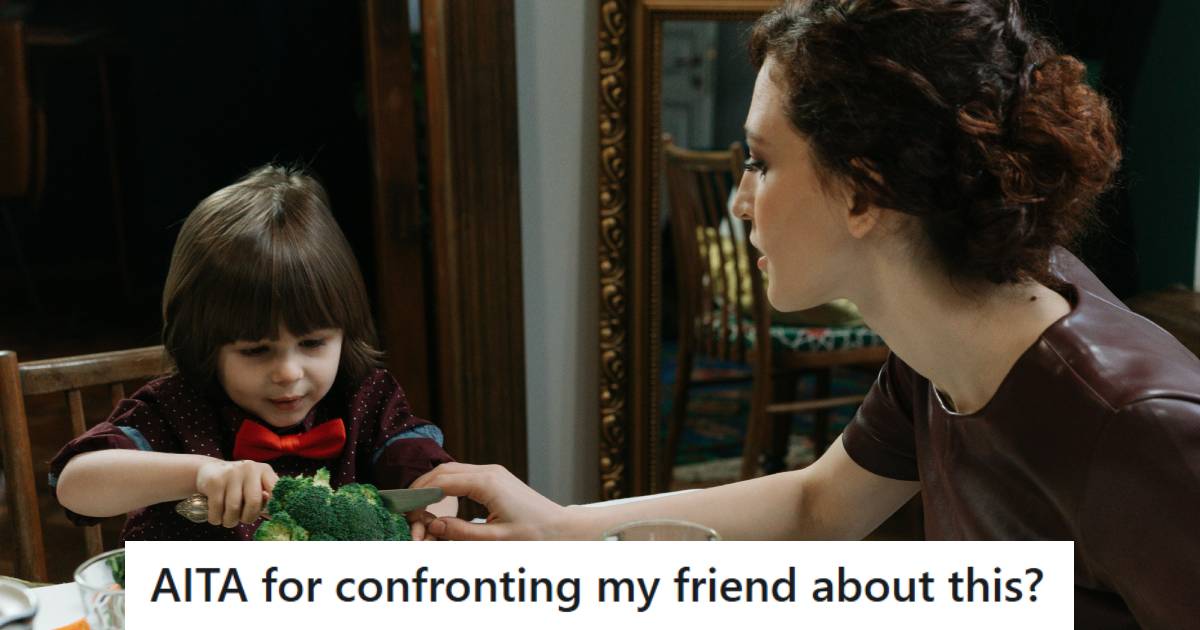 Babysitter helping her client's child eat his food at lunch