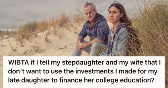 Man and teenager sitting on a beach together, looking pensive