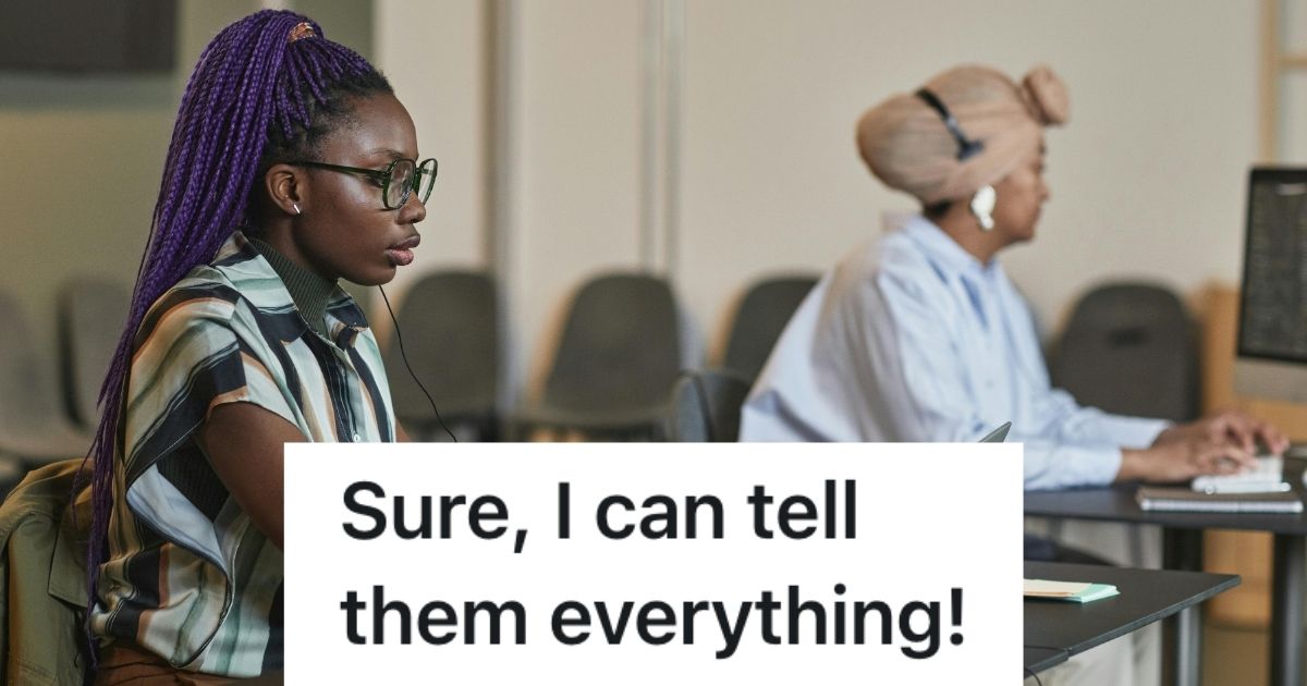 Two women at computer desks, typing and looking serious