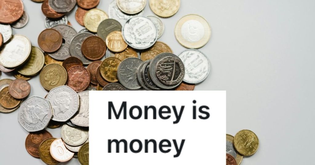 A large amount of coins spread out on a counter