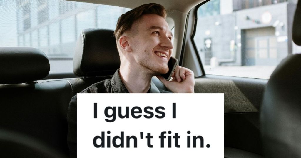 Young man talking on cell phone in car, smiling