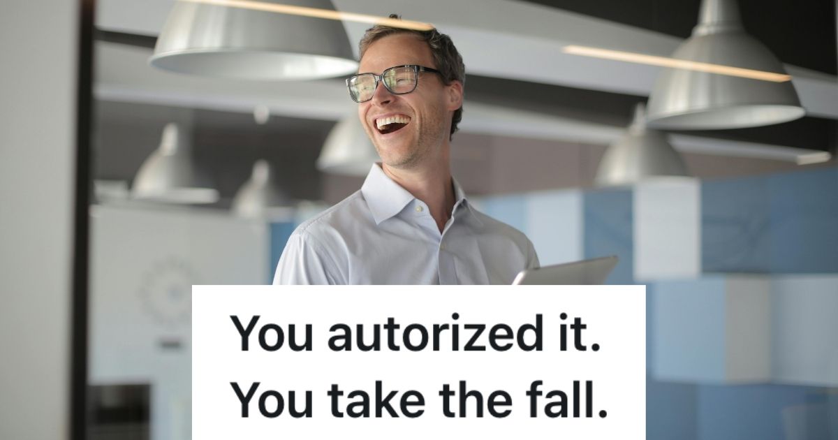 Office worker smiling and holding a tablet