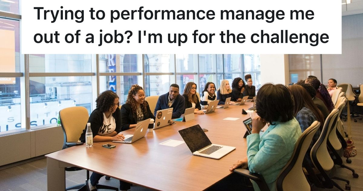 People sitting at a large office meeting room desk