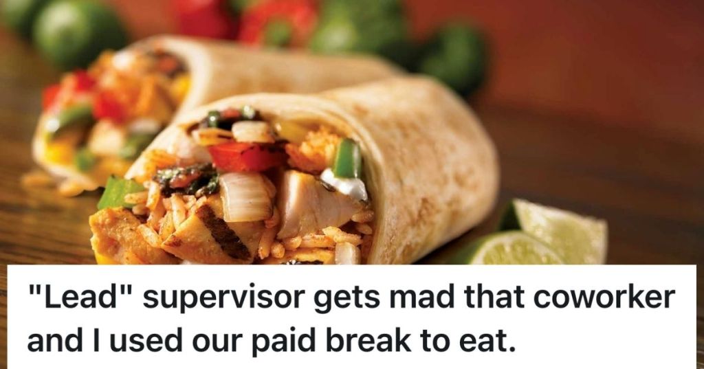 Two burritos on a table with lots of filling