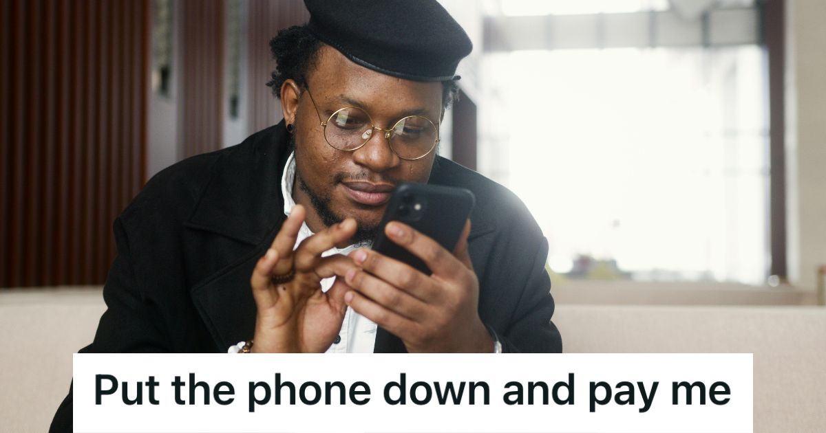 Man sitting down looking at his phone