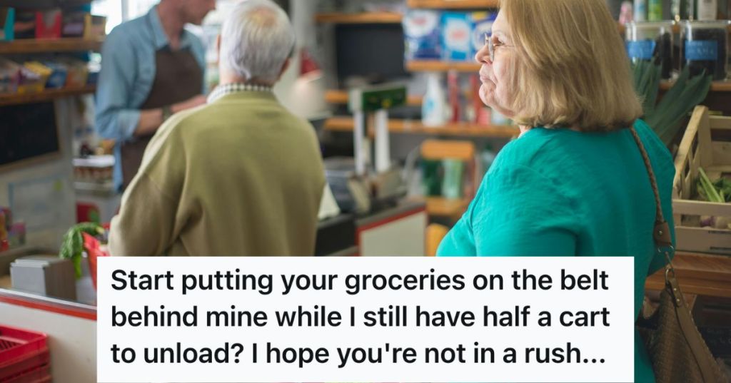 Older woman queueing up at the grocery checkout counter