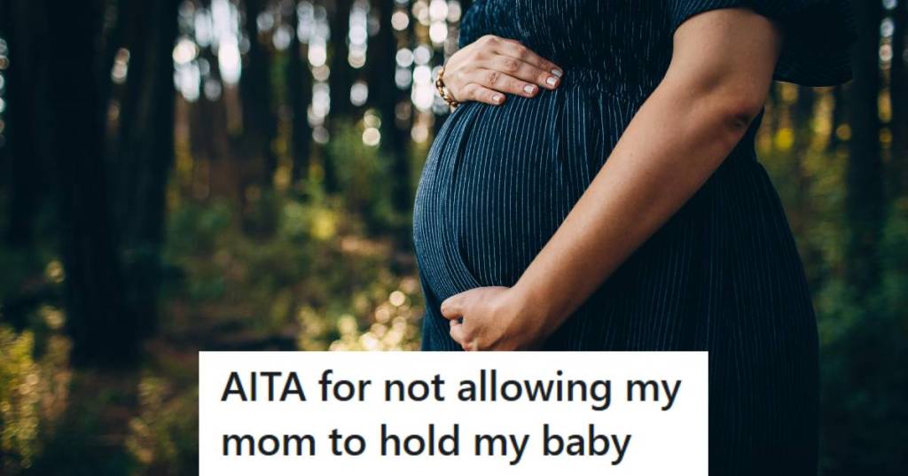 Pregnant woman holding her stomach for a photo shoot