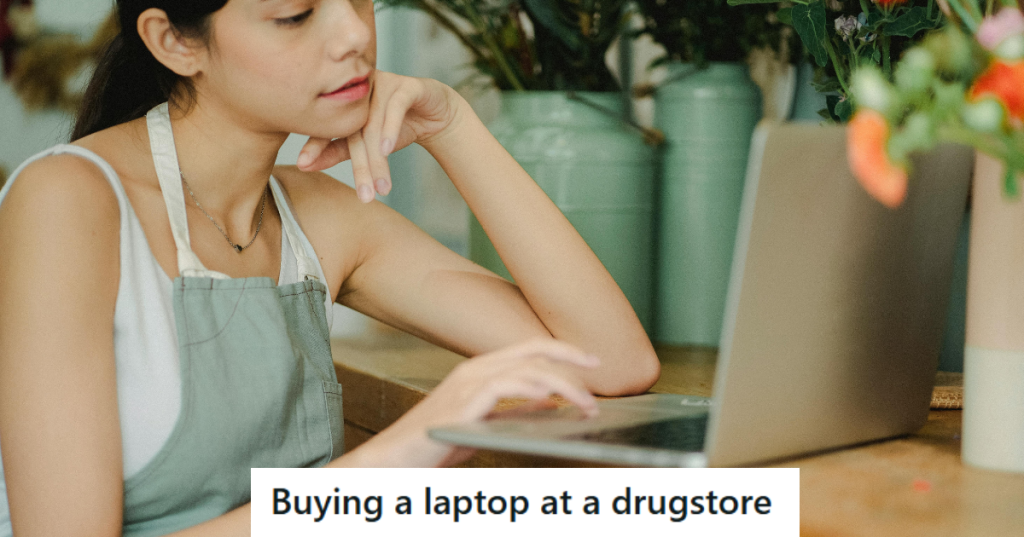 Girl in apron working on laptop