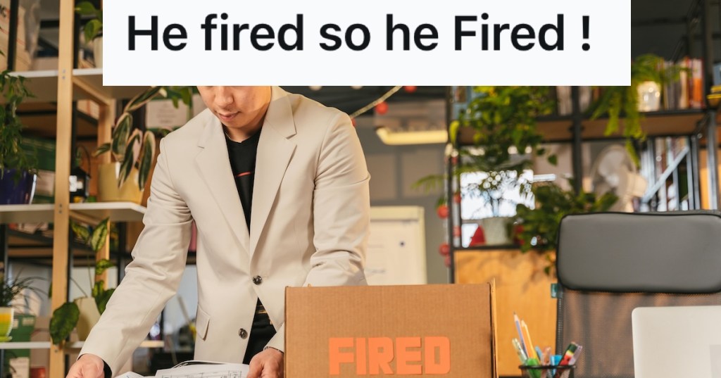Man in an office packing a box labeled 