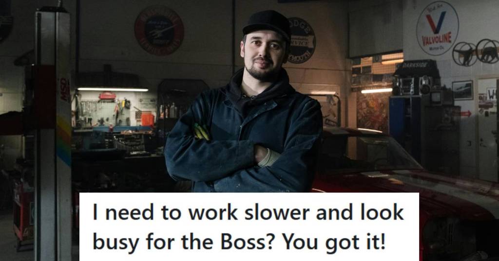 Mechanic smiling and posing for the camera because he has nothing better to do