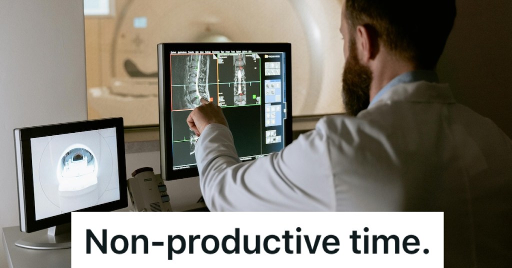 Man in lab coat using a medical device