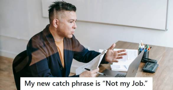 Man sitting at his desk, explaining to his manager that it's not his job