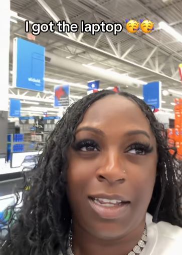 Woman shopping for a laptop