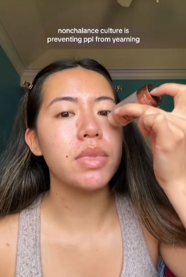 Woman talking and putting on makeup