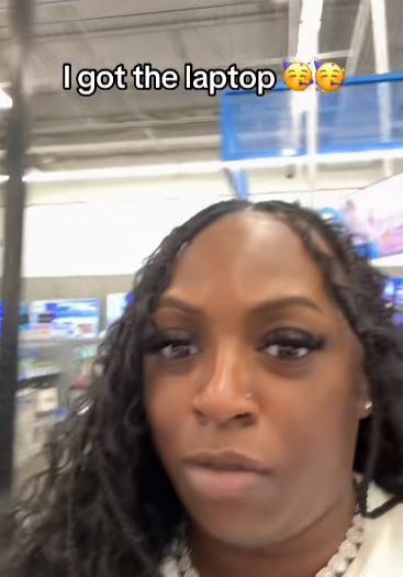 Woman shopping for a laptop