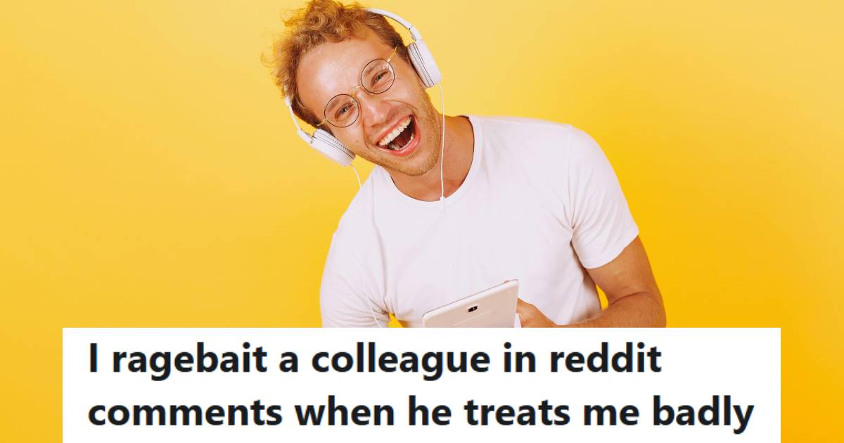 Man smiling while holding his tablet because he's trolling a coworker on Reddit