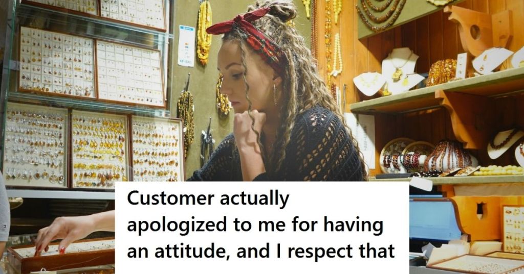 Employee of jewelry store behind counter