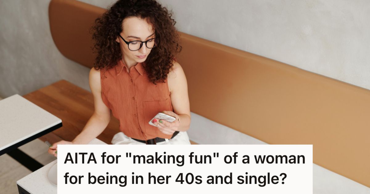 Woman sitting at a table texting