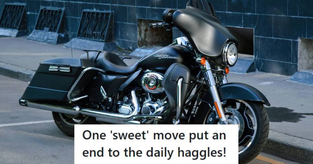 Harley Davidson motorcycle parked in front of an apartment building