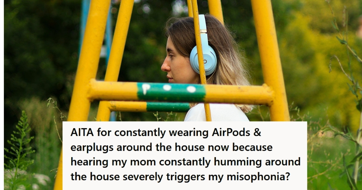 Girl wearing headphones in swingset