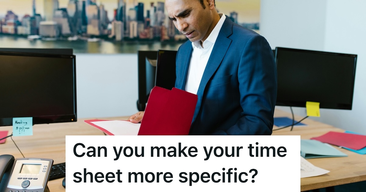 Man in suit looking confused at a folder of papers