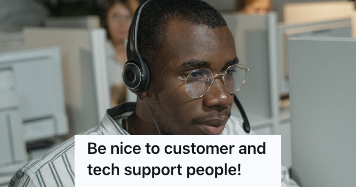 Male customer support agent working in the office with a headset