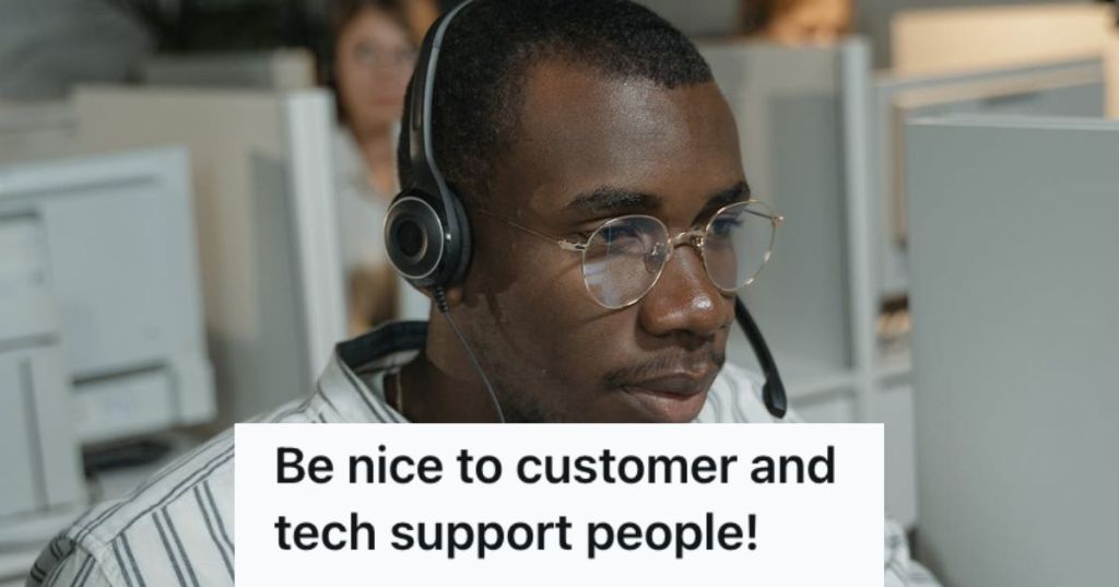 Male customer support agent working in the office with a headset
