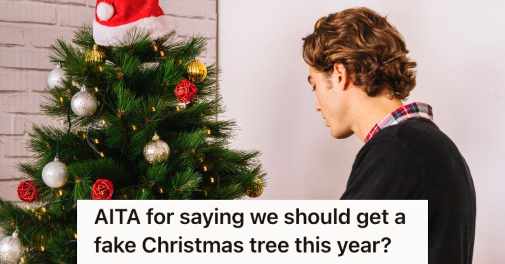 Man setting up a Christmas tree