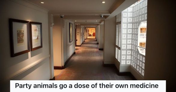 A hotel corridor with lights and windows