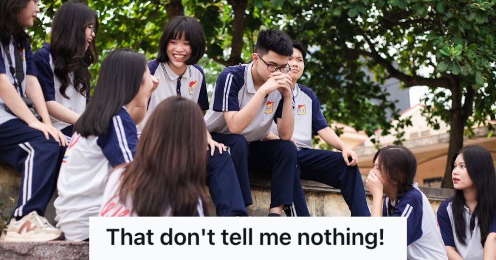 Group of high school students talking to each other and laughing