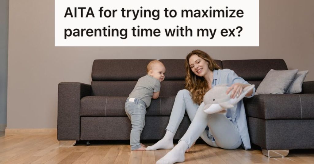 Woman playing with her baby boy while sitting on the floor