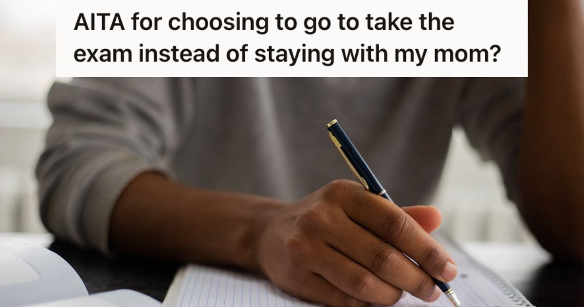 Man writing on a notebook using a pen