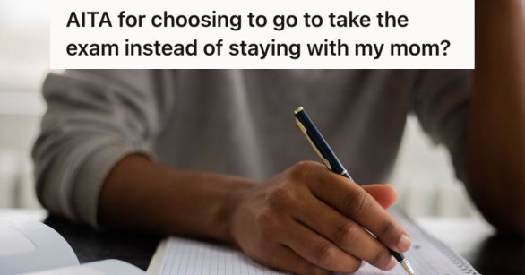 Man writing on a notebook using a pen