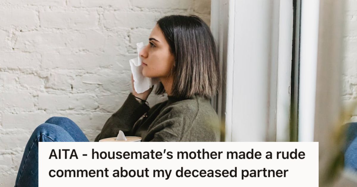 Sad woman wiping her tears with a tissue