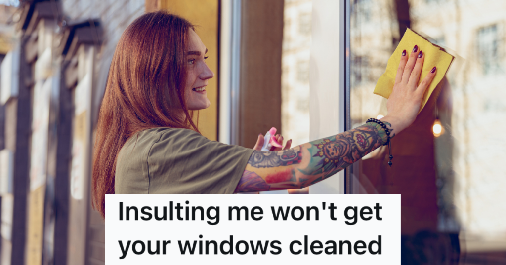 young woman washing store windows