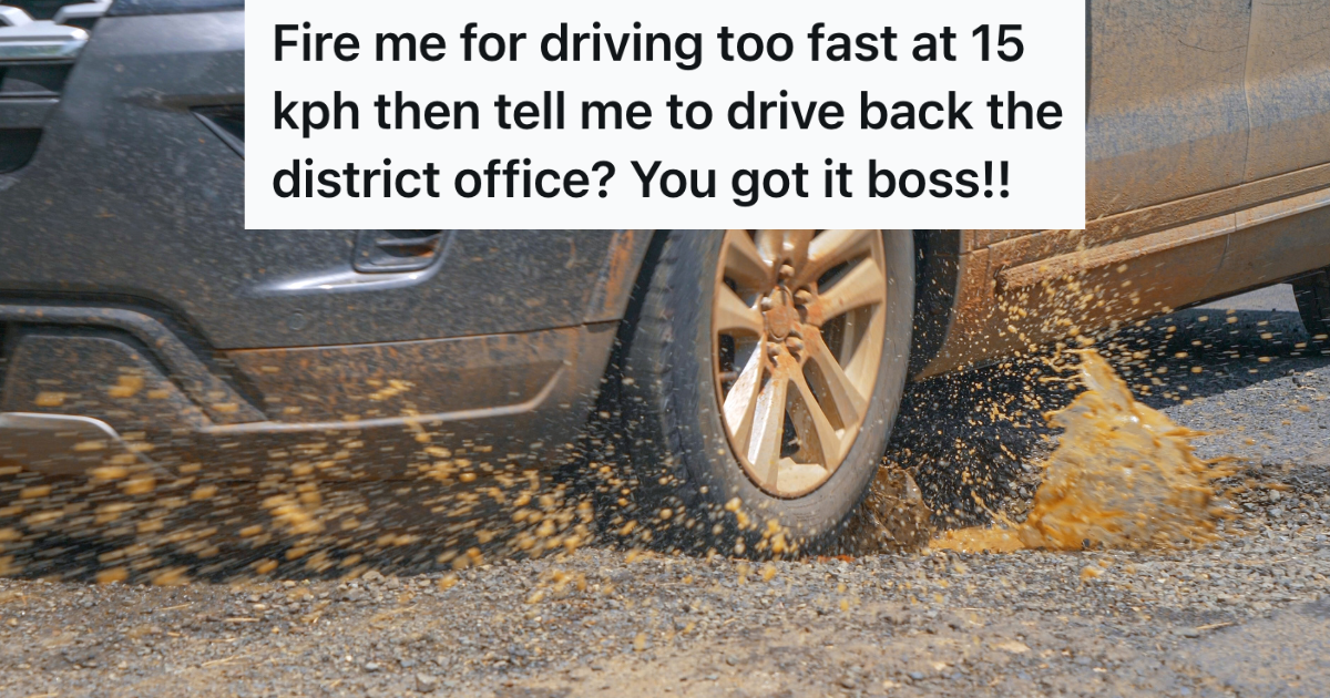 closeup of car tire hitting pothole filled with muddy water