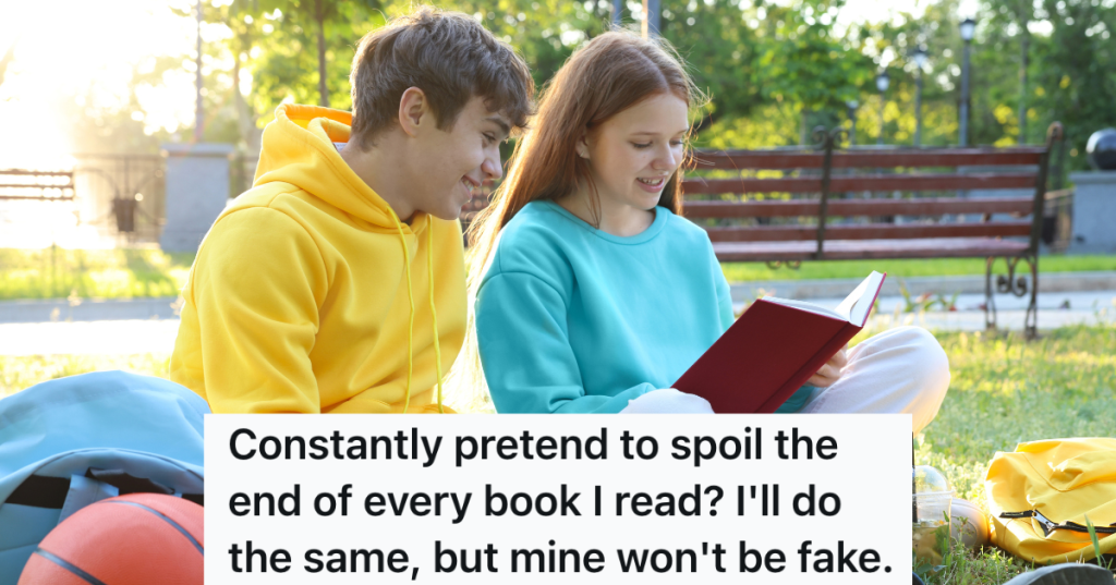 teenage boy and girl looking at a book outside