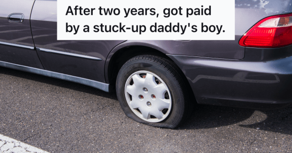car with flat tire in parking lot