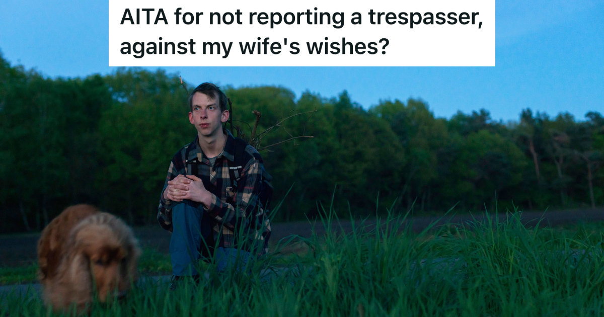 teenage boy and dog sitting on the ground in the country